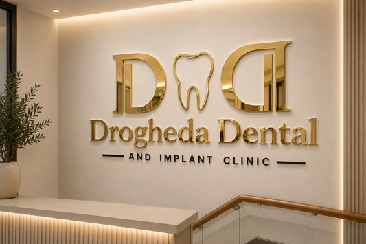 Custom 3D acrylic business logo wall letters in gold mirror for a dental clinic reception in Ireland